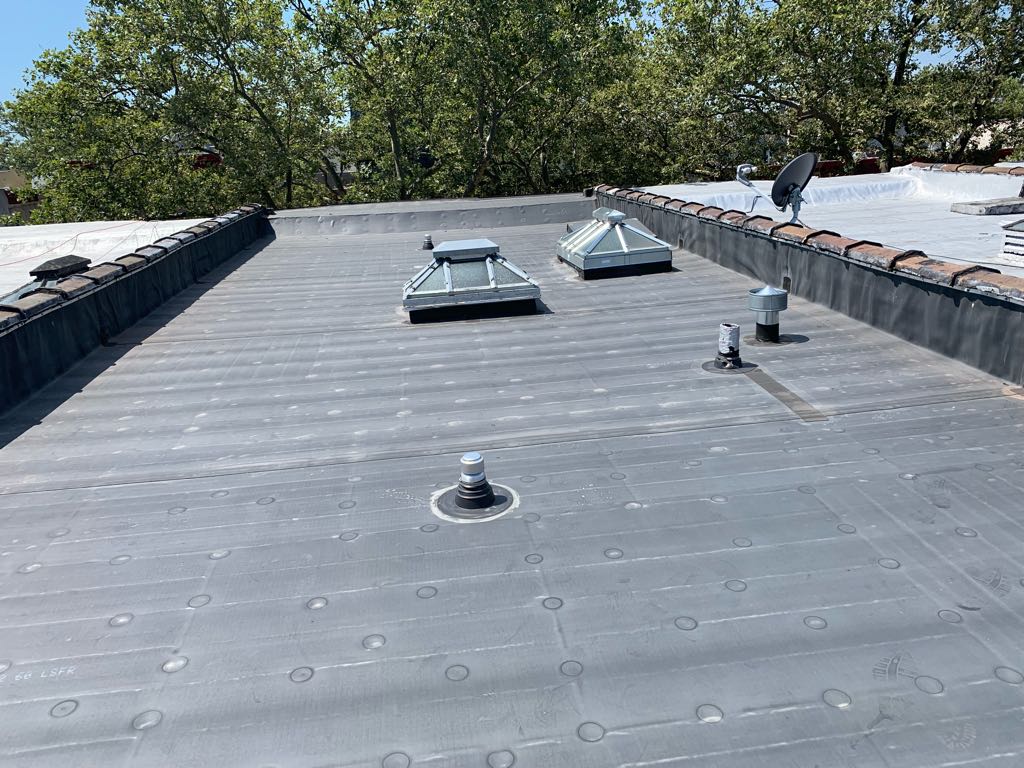 Flat roof with skylights professionally installed